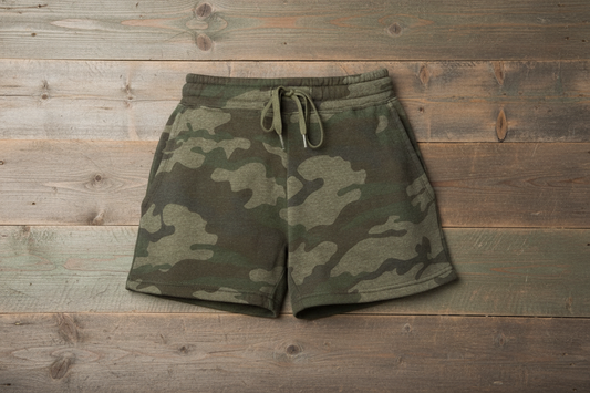 Forest green camo heather shorts on wooden background