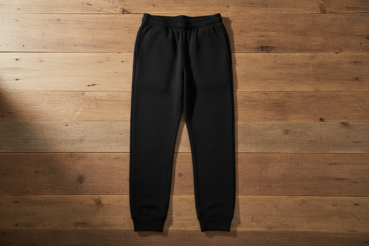 Jet black joggers on wood