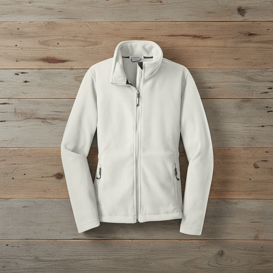 Winter white fleece jacket on wooden background