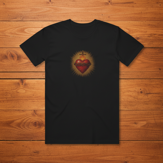 Black Sacred Heart tee on warm wooden slats