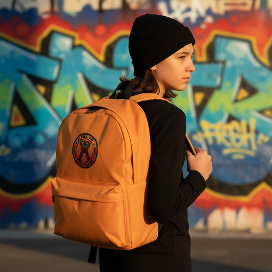 Classy urban side view - kid with black tee, beanie, and super orange backpack
