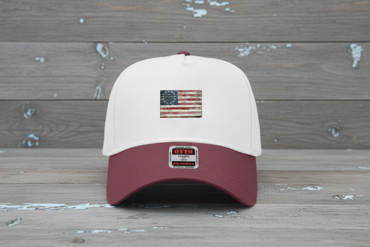 Maroon Betsy Ross cap on gray distressed wood